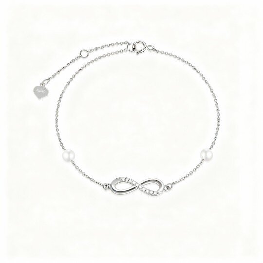 Pulsera con dije de símbolo de infinito, diamantes y perlas en oro blanco de 10 quilates