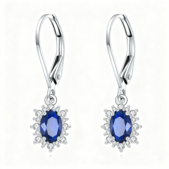 Brincos em ouro branco 10K com safira lapidada em formato marquise e fecho de alavanca.