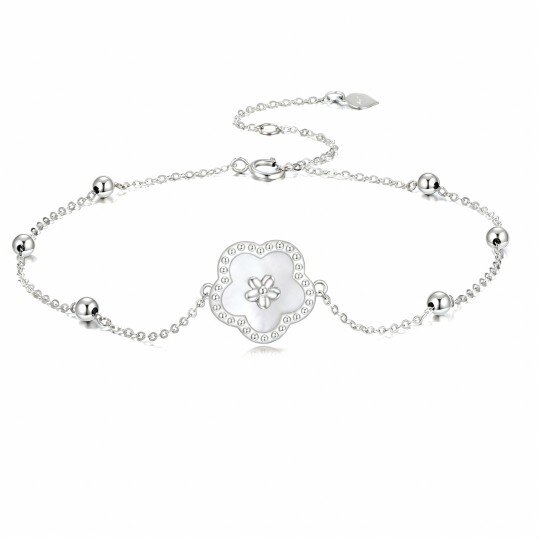 Pulseira em ouro branco de 10 quilates com pendente de margarida e missangas em madrepérola.