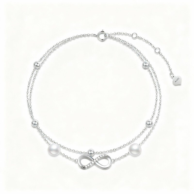 Bransoletka na kostkę z 10-karatowego białego złota z cyrkoniami sześciennymi, perłowymi koralikami i symbolem nieskończoności, wielowarstwowa-7