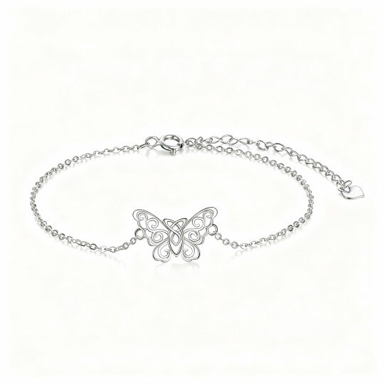 Pulsera con dije de mariposa y nudo celta en oro blanco de 10 quilates