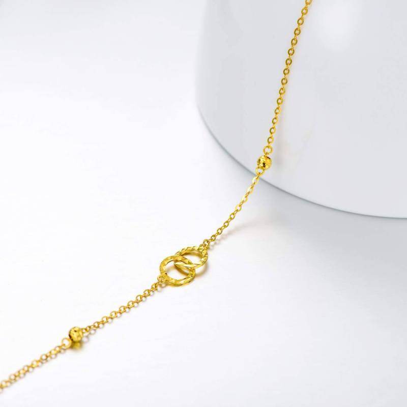 Pulsera con dije de círculo y símbolo de infinito en oro de 18 quilates-3