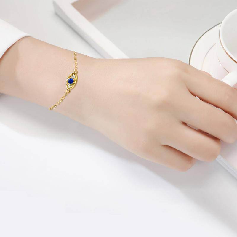 Pulsera con dije de ojo turco de circonita cúbica y oro de 10 quilates-2