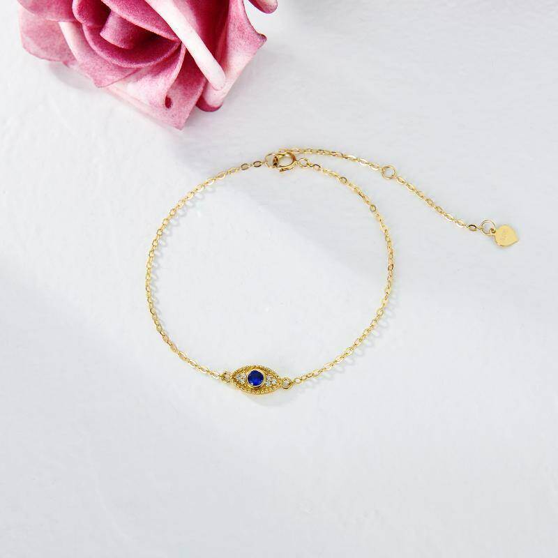 Pulsera con dije de ojo turco de circonita cúbica y oro de 10 quilates-3