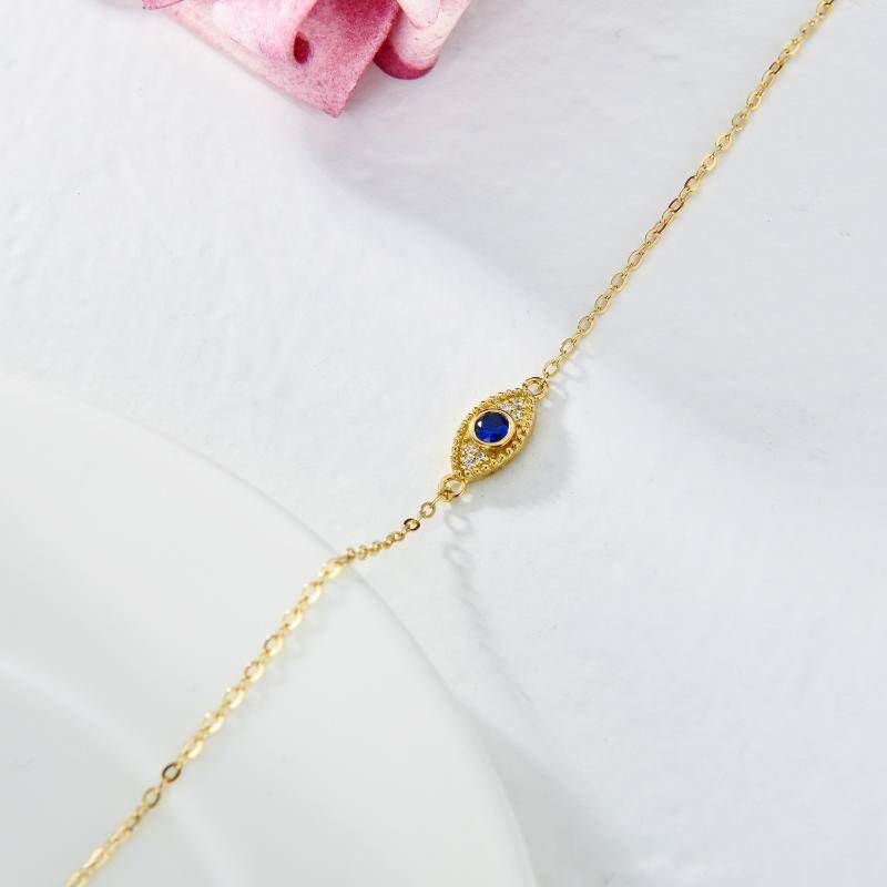 Pulsera con dije de ojo turco de circonita cúbica y oro de 10 quilates-4