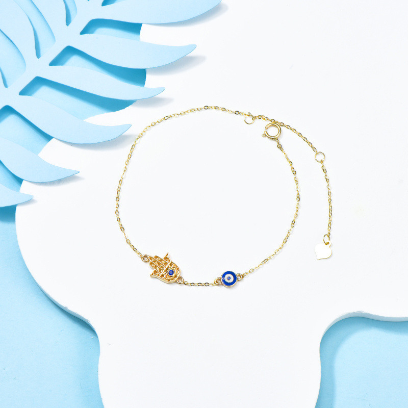 Pulsera con dije de ojo turco y mano de Fátima en oro de 18 quilates con circonitas cúbicas-3