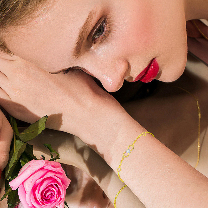 Pulsera con dije de corazón y símbolo de infinito en oro rosa de 18 quilates con circonitas cúbicas-3
