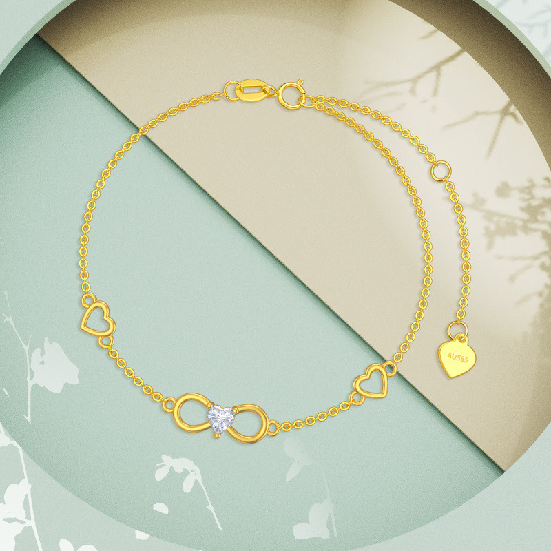 Pulsera con dije de corazón y símbolo de infinito en oro rosa de 18 quilates con circonitas cúbicas-4