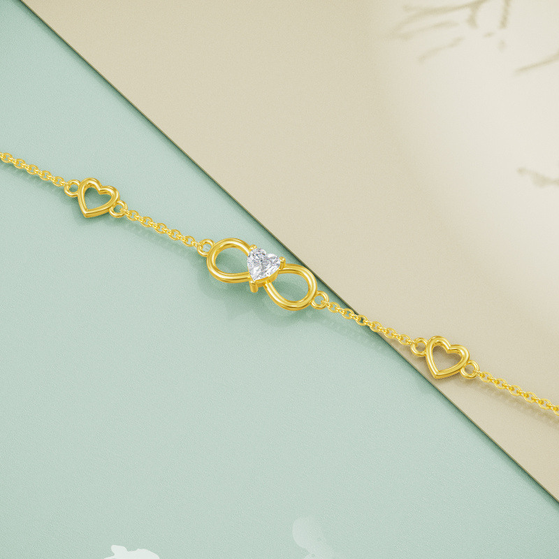 Pulsera con dije de corazón y símbolo de infinito en oro rosa de 18 quilates con circonitas cúbicas-5