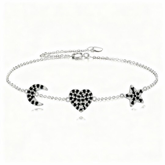 Pulsera de oro blanco de 10 quilates con dije de corazón, luna y estrella de circonita cúbica.