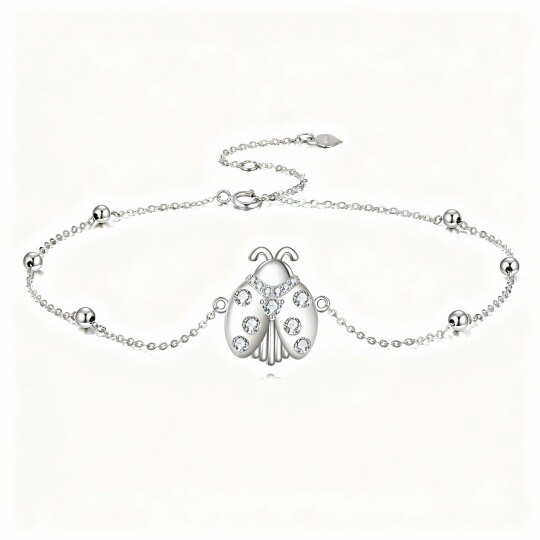 Pulseira com pendente joaninha em ouro branco 10K e zircónias cúbicas