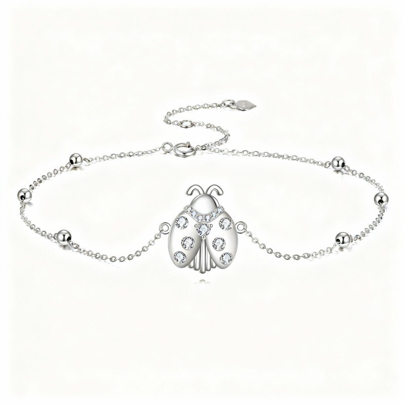 Pulsera de platino con dije de mariquita y circonitas cúbicas chapadas en oro blanco-1