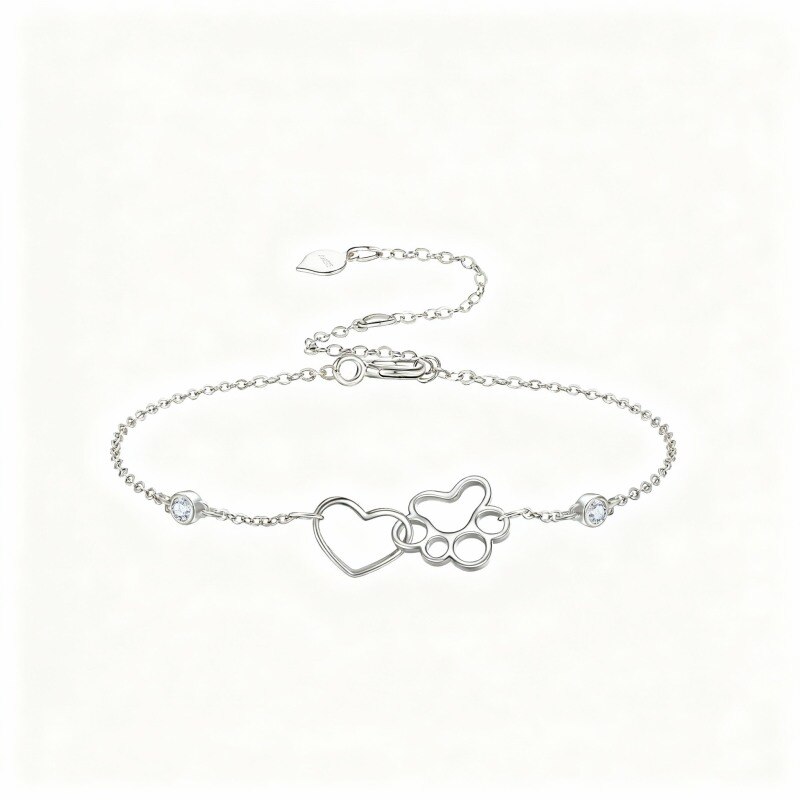 Pulseira com pendente de pata e coração em platina com banho de ouro branco e zircónias cúbicas.-1