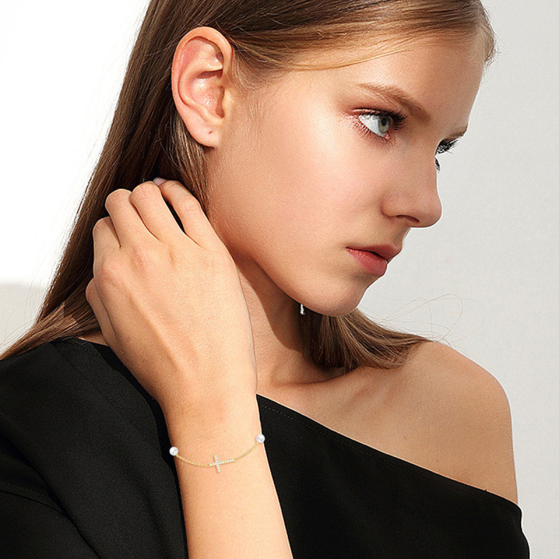 Armband aus 10-karätigem Gold mit Diamanten und Perlen in Kreuzform-2