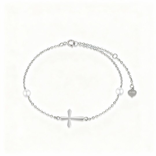 Pulsera con dije de cruz de perlas en oro blanco de 10 quilates