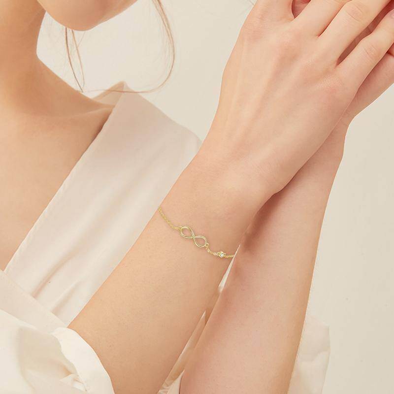 Pulsera con dije del símbolo del infinito en oro de 10 quilates-2