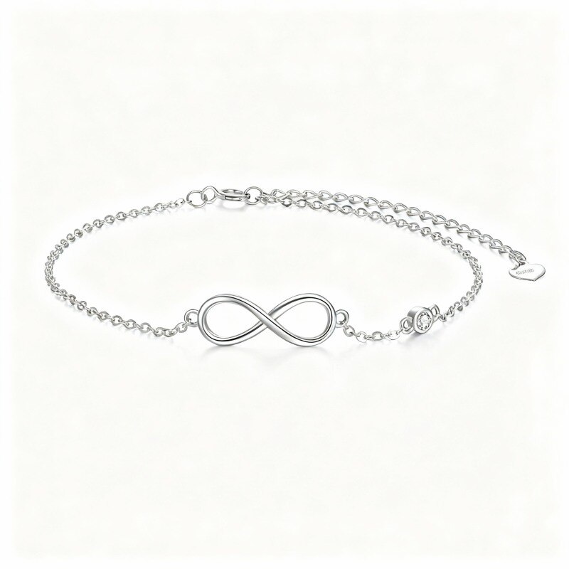 Pulsera con dije de símbolo de infinito de circonita cúbica de corte redondo en oro blanco de 10 quilates-1