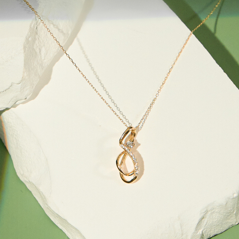 Collar con colgante de símbolo infinito circular de circonita cúbica en oro de 14 quilates-3