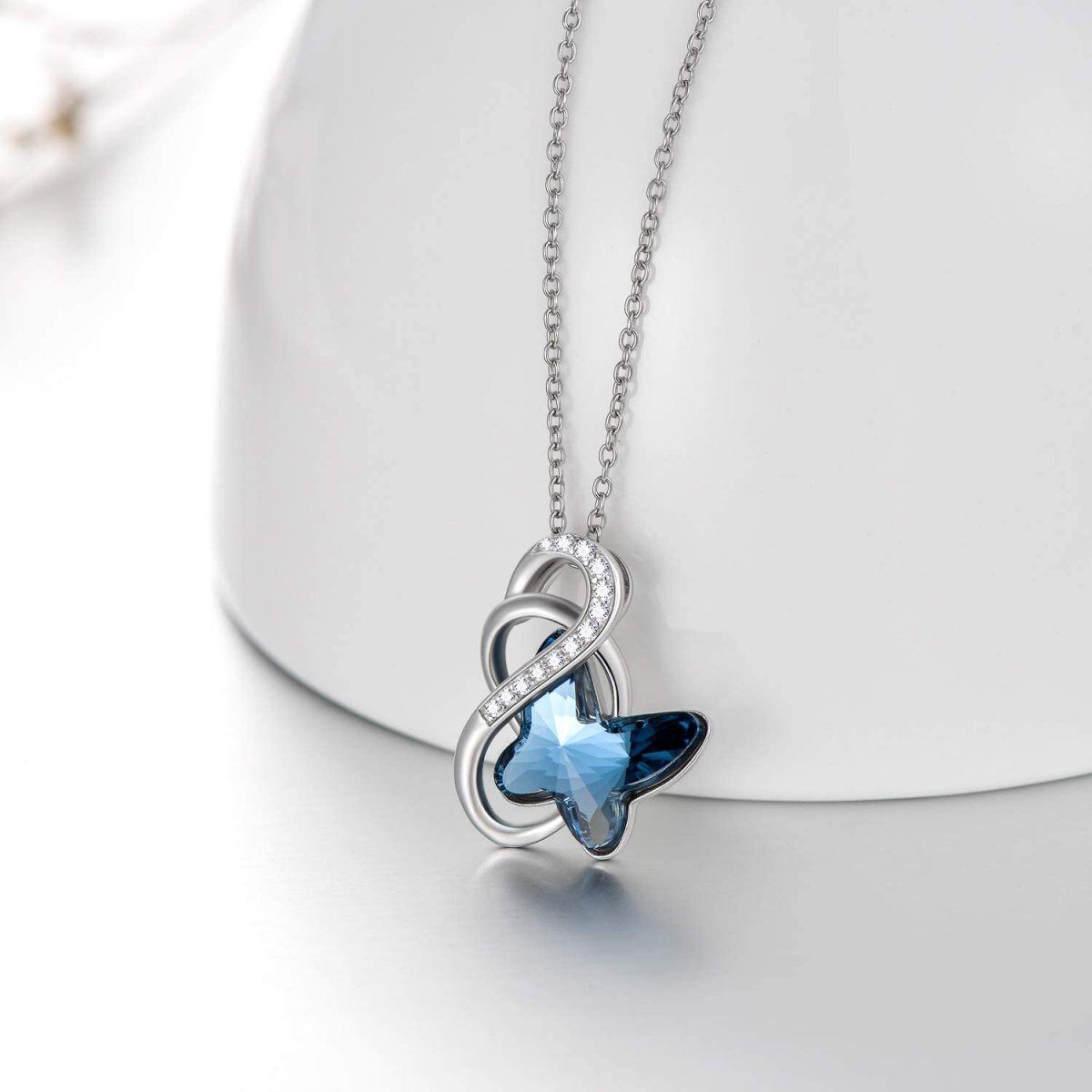 Collar con colgante de mariposa de cristal azul y símbolo del infinito en plata de ley para mujer-3