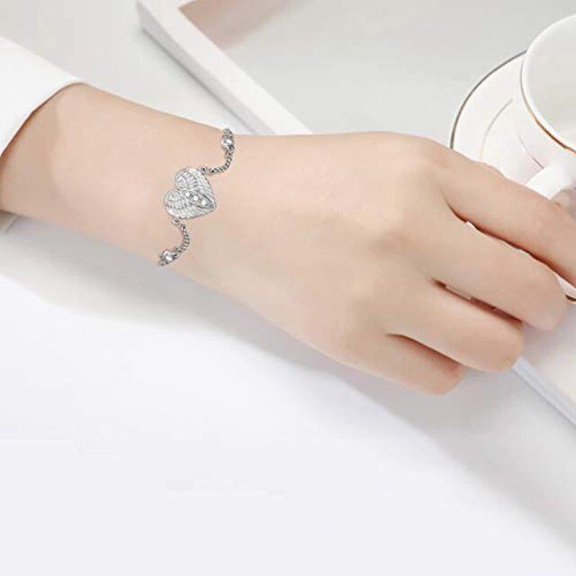 Pulsera de plata de ley con forma redonda de ala de ángel y corazón de circonita cúbica pa-6