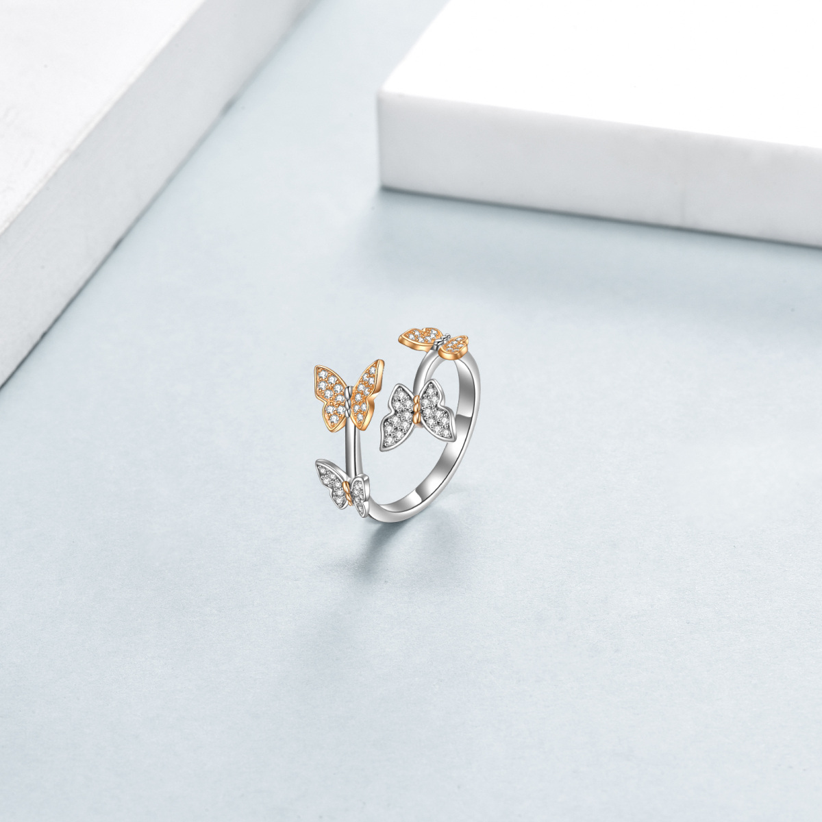 Anillo abierto de mariposa con circonita cúbica en forma circular de dos tonos en plata de ley-4