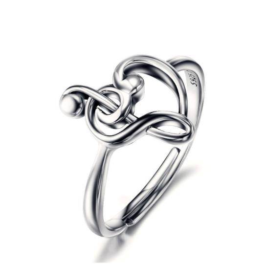 Anillo abierto con símbolo musical y corazón en plata de ley