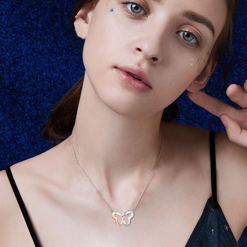 Collar con colgante de corazón y mariposa en dos tonos de plata de ley-2